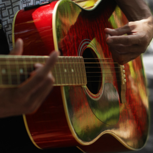 strumming a guitar